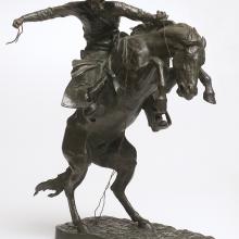 <a href="https://spencerartapps.ku.edu/collection-search#/object/9412" target="_blank"><i>The Bronco Buster</i> by Frederic Remington</a>