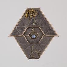 <a href="https://spencerartapps.ku.edu/collection-search#/object/22349" target="_blank"><i>Frog Labyrinth (brooch and stand)</i> by Kevin Coates</a>