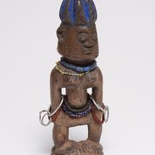 <a href="https://spencerartapps.ku.edu/collection-search#/object/36974" target="_blank"><i>ere ibegji (twin figure)</i> by Yoruba peoples</a>
