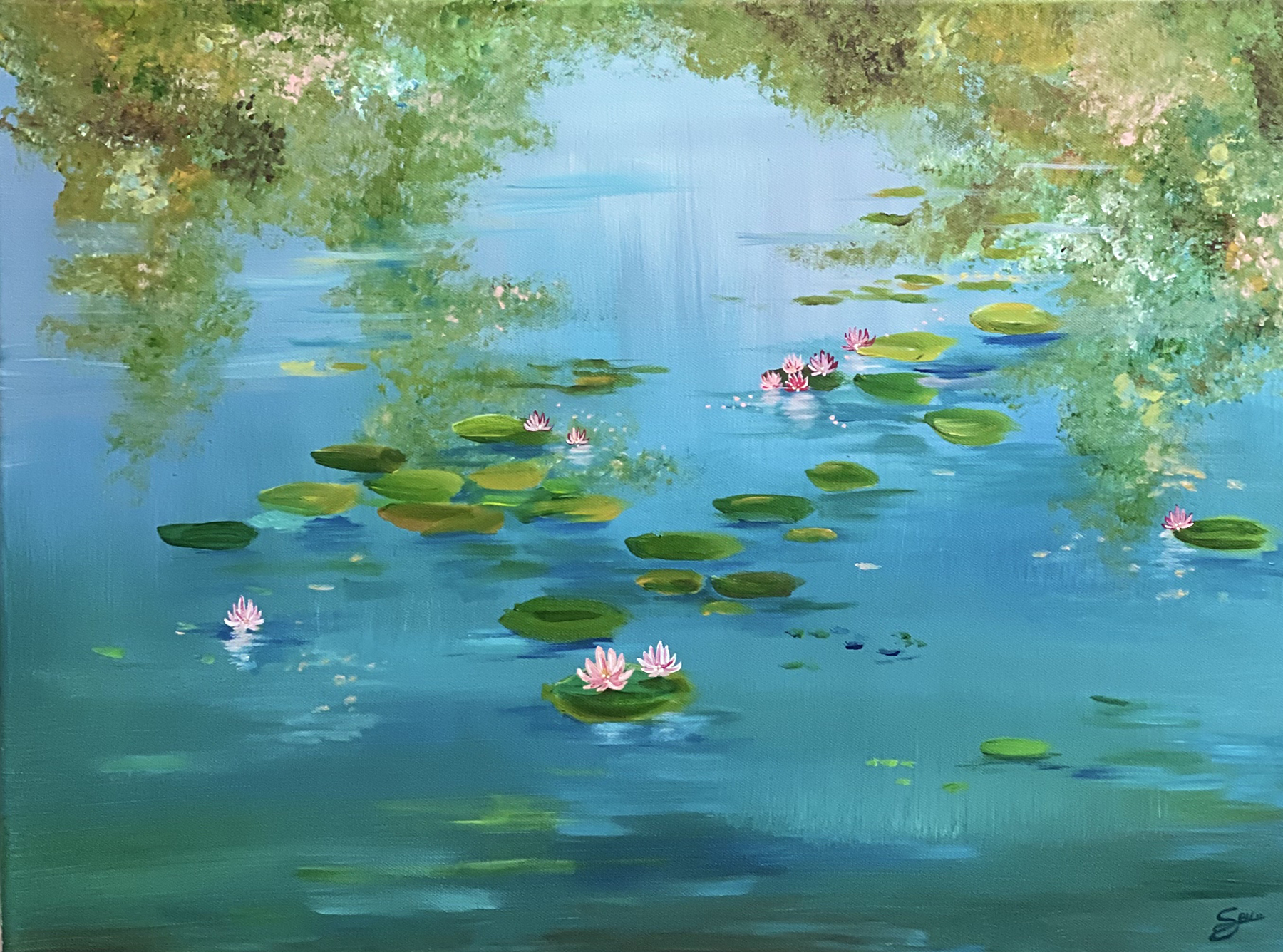 Brilliant green lily pads and pink lotus flowers float in a cerulean pond