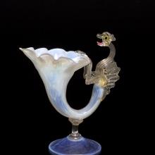 <a href="https://spencerartapps.ku.edu/collection-search#/object/6306" target="_blank"><i>vase with dragon apendage</i> by Italy</a>