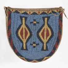 <a href="https://spencerartapps.ku.edu/collection-search#/object/32786" target="_blank"><i>beaded pouch</i> by Arapaho peoples</a>
