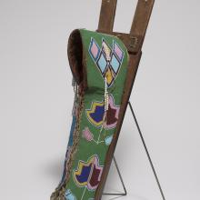 <a href="https://spencerartapps.ku.edu/collection-search#/object/31438" target="_blank"><i>cradleboard</i> by Kiowa peoples</a>