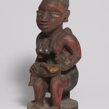 <a href="https://spencerartapps.ku.edu/collection-search#/object/35392" target="_blank"><i>mother with children figure</i> by Oyo peoples</a>