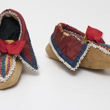 <a href="https://spencerartapps.ku.edu/collection-search#/object/38131" target="_blank"><i>pair of child's beaded moccasins</i> by Osage peoples</a>