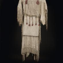 <a href="https://spencerartapps.ku.edu/collection-search#/object/32097" target="_blank"><i>three-hide dress</i> by Kiowa peoples</a>