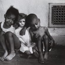 <a href="https://spencerartapps.ku.edu/collection-search#/object/18184" target="_blank"><i>black children with white doll</i> by Gordon Parks</a>
