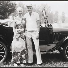 <a href="https://spencerartapps.ku.edu/collection-search#/object/54861" target="_blank"><i>untitled (couple posing in front of a convertible buggy)</i> by Thaddeus Holownia</a>