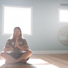 Air Force veteran Kerry Dean Steuart sits in his own yoga studio in Kansas City. Photographed by John Howe