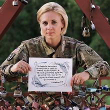 Major Kristen Hesterberg is pictured here with the Old Red Bridge "Love Locks," which is a place where she finds peace. Photographed by Chuong Doan